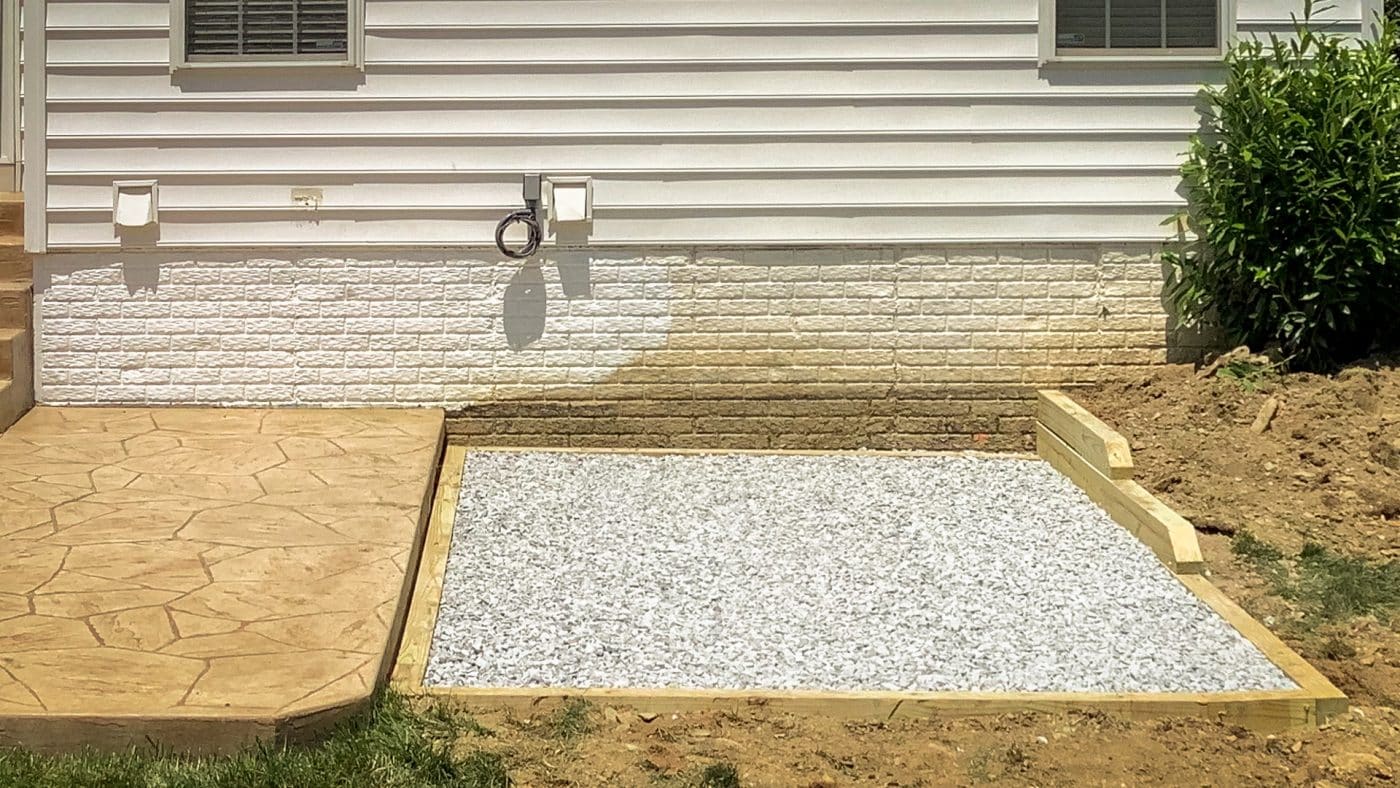 A gravel hot tub pad