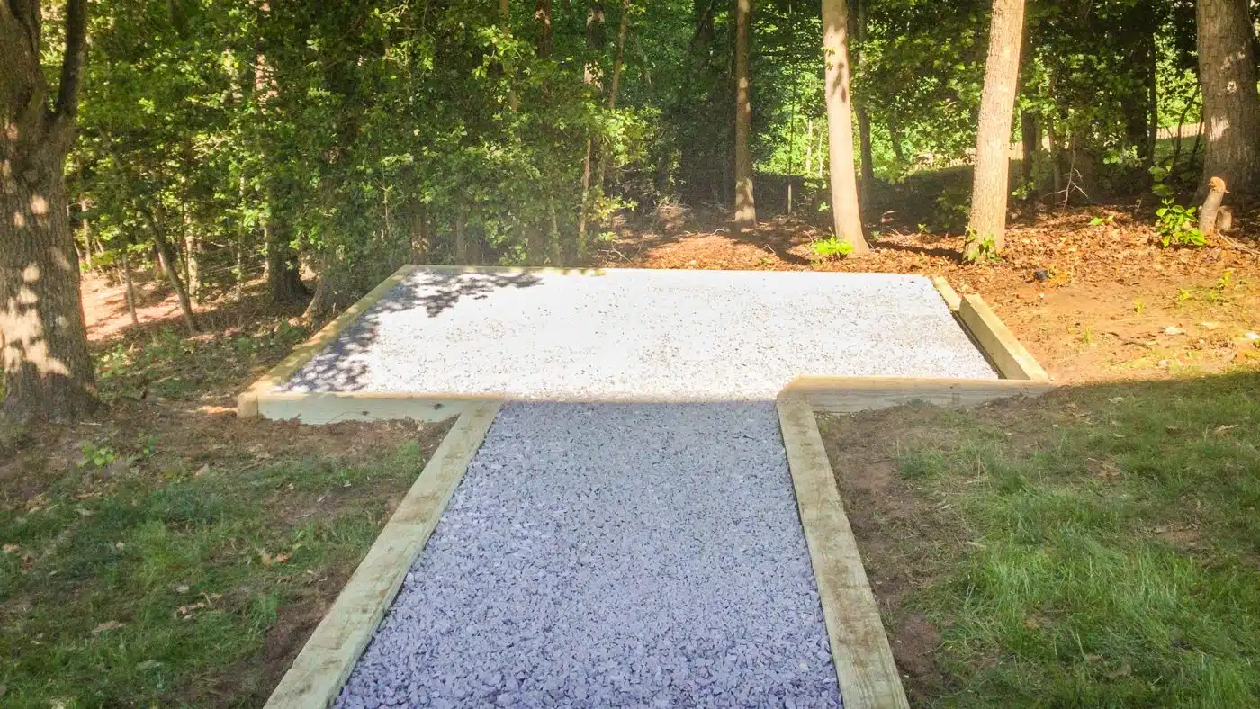 A gravel patio area with a gravel walkway