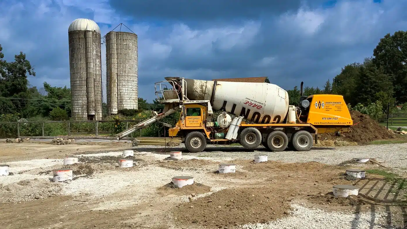 Pouring shed foundation piers with a concrete truck