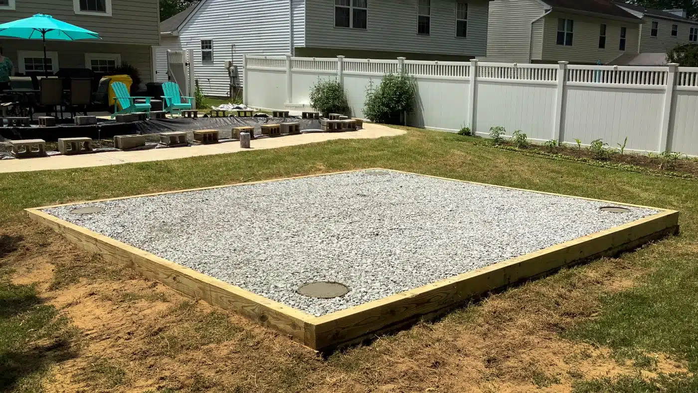 Gravel pad with concrete shed foundation piers