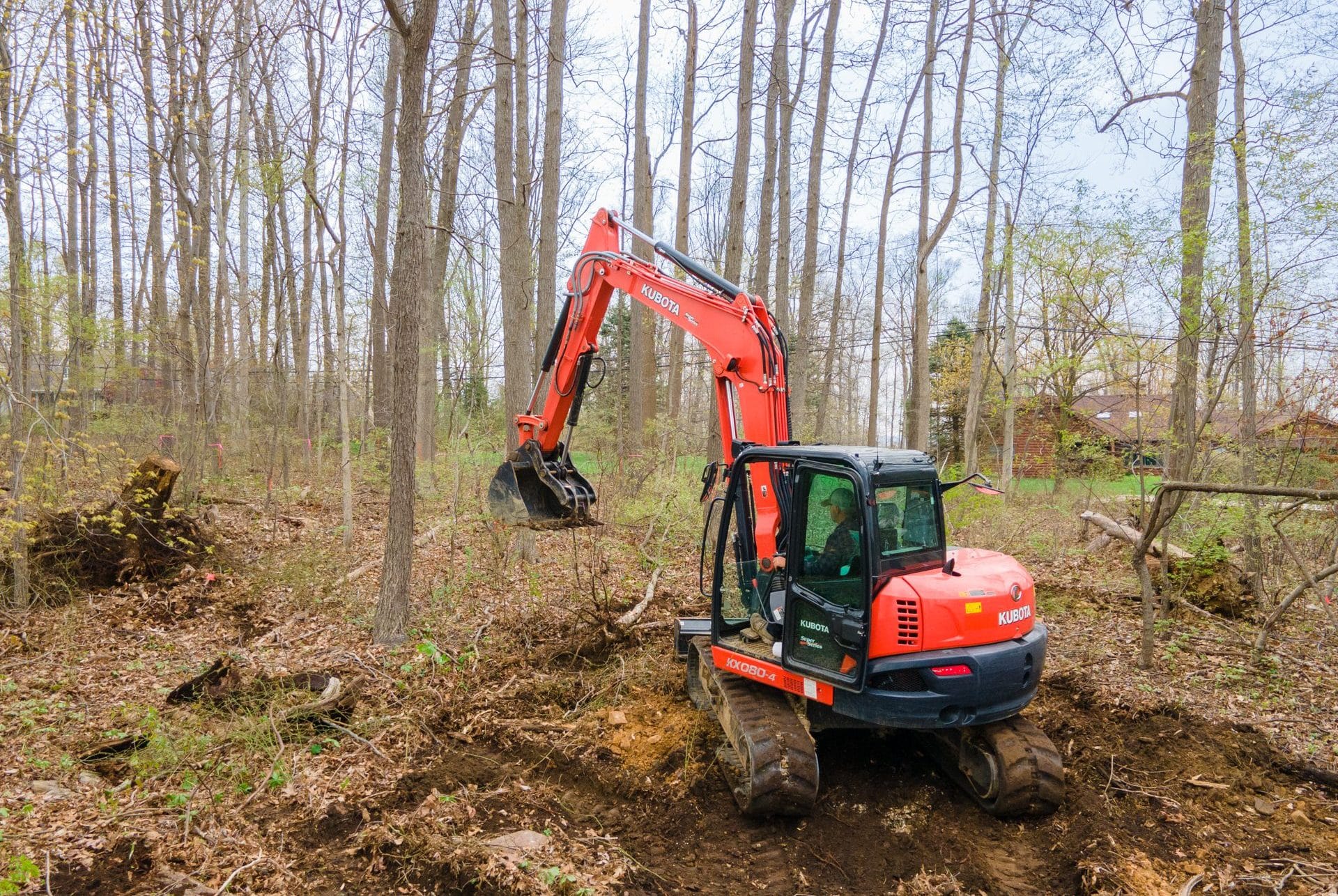 man excavating ground for shed foundation and other services page