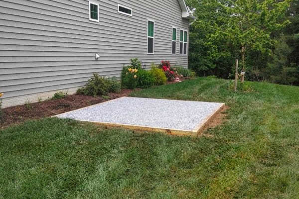 A shed foundation made from crushed stone