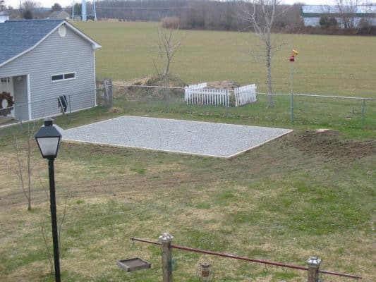 Gravel site preparation for a backyard shed
