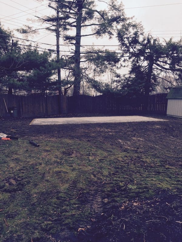Gravel shed foundation in a backyard