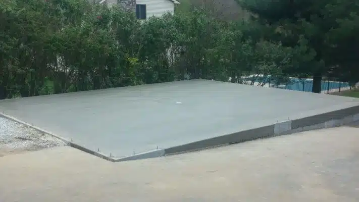 A concrete garage foundation built on a slope